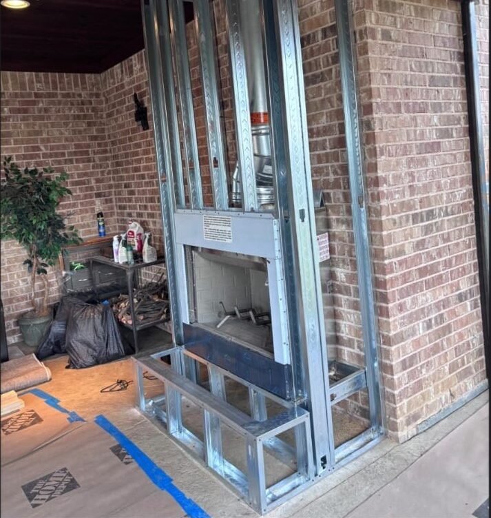 Projects outdoor patio wood burning fireplace insert installation in Frisco Texas